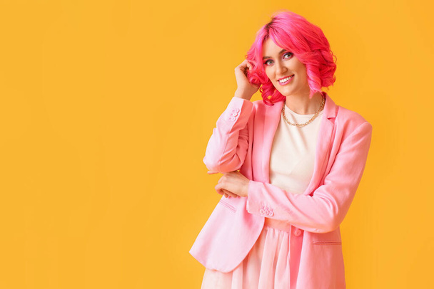 Stylish woman with bright hair on color background - Foto, afbeelding