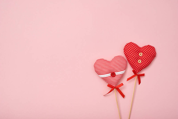Valentine composition made of two love hearts on pink background. Flat lay, top view, copy space - Foto, afbeelding
