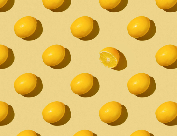 Pattern of Lemons on a yellow background - top view - Foto, Imagen