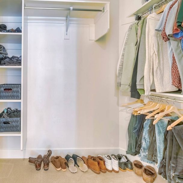 Square Walk in closet interior with hanging clothes and shoes on the floor - Photo, Image