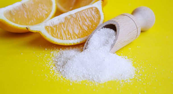 Citric acid on a yellow background. Selective focus.nature - Photo, Image