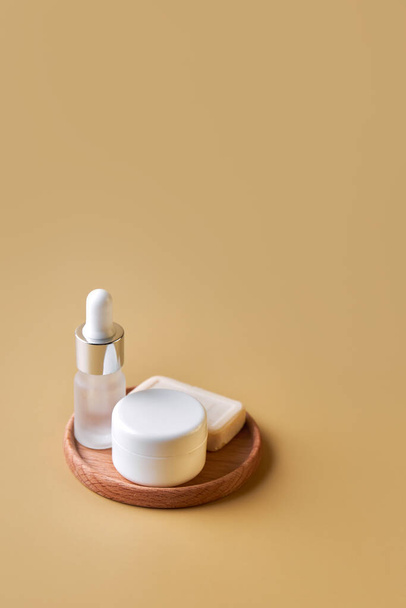 SPA composition. Set of copyspace cosmetic bottles and tubes. Face and body care concept, bottles of creams, lotions, serums. Selective focus, sallow DOF, close up. - Fotó, kép