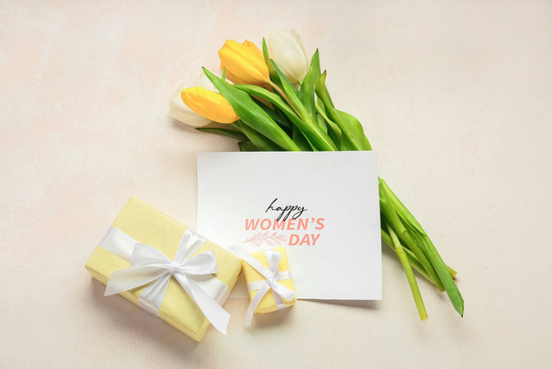 Card for International Women's Day, gift boxes and tulip flowers on light background - Photo, Image