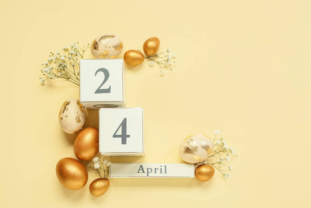Composition with calendar, Easter eggs and flowers on beige background - Fotoğraf, Görsel
