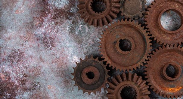 Old rusty metal gears on a rusty textural background  - Zdjęcie, obraz