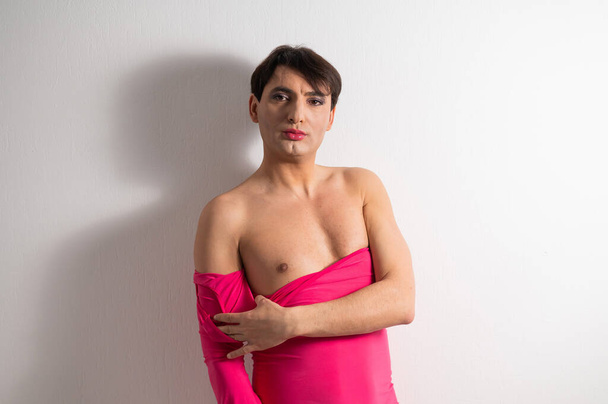 Homosexual in a pink female dress. A man in make-up. - Foto, Imagem