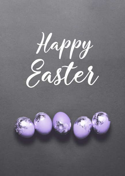 Stylish easter eggs on dark black background. Flat lay trendy easter. Happy easter card. Copy space for text - Fotó, kép