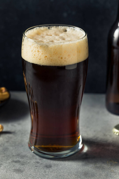 Boozy Cold Brown Ale Lager in a Pint Glass - Foto, afbeelding