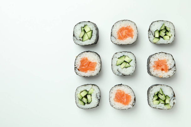 Concept of tasty food with sushi rolls on white background - Photo, Image