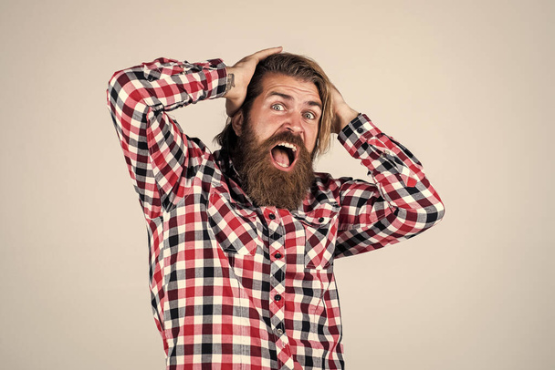 scared handsome bearded guy with unshaven face and stylish hairdo wear casual clothes, stress - Foto, immagini