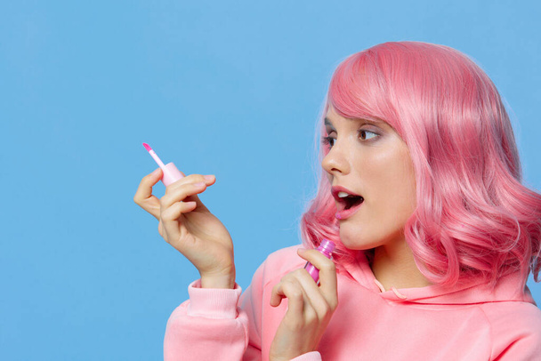 woman lip gloss makeup pink hair Lifestyle fashion - Foto, Imagem
