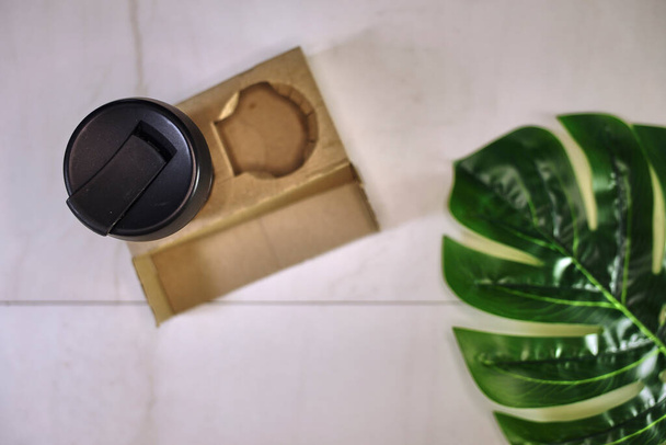 A studio photo of a takeaway coffee cup - Fotó, kép