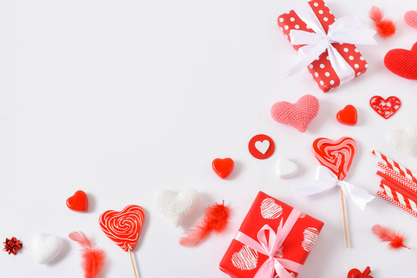 Background with red accessories for a festive Valentine's Day. Banner for February 14. Valentine's Day greeting card. Copy space. Flat lay, top view. - Photo, Image