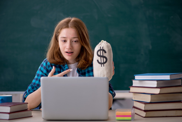 Young female student in expensive education concept - Photo, Image