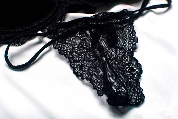 Beautiful black lace panties - thongs. Black lace lingerie. - Fotografie, Obrázek