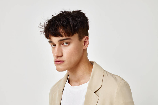 A young man self confidence fashion blazer isolated background unaltered - Valokuva, kuva