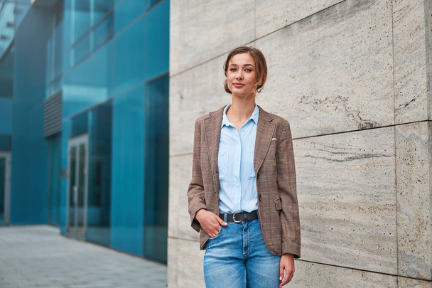 Businesswoman successful woman business person standing outdoor corporate building exterior Pensive elegance cute caucasian confidence professional business woman middle age female Bank worker - Фото, зображення