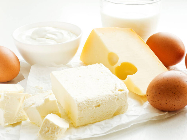 Dairy food products and eggs on the white wooden table. Shallow dof. - Foto, Imagen