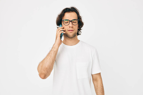 Attractive man telephone communication hand gesture light background - Fotó, kép