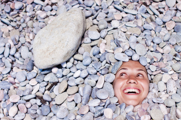 Funny girl in stones - Foto, Imagen
