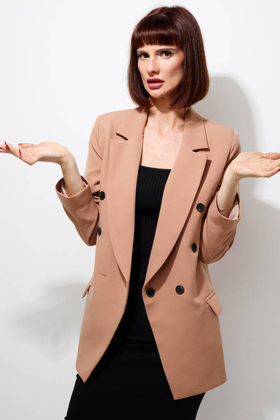 attractive woman short haired suit gesturing with hands Lifestyle unaltered - Valokuva, kuva