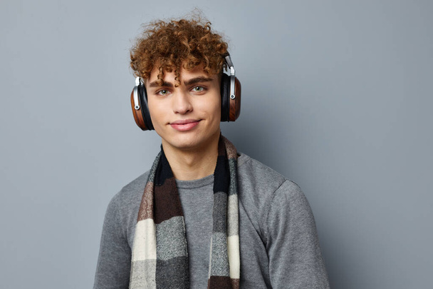 handsome young man fashion posing headphones isolated background - Foto, Imagem