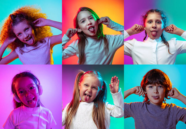 Making faces. Set of portraits of little cute kids, boys and girls isolated on multicolored studio background in neon light. Education, wow emotions - Fotografie, Obrázek