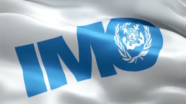 IMO-Logo. Das Logo der Internationalen Seeschifffahrtsorganisation (IMO) weht. Zeichen einer nahtlosen IMO-Animation. Flagge der Internationalen Seeschifffahrtsorganisation HD Hintergrund - New York, 4. Juli 2021 - Filmmaterial, Video