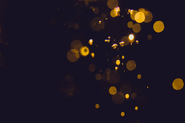 Luxury Gold abstract bokeh on black background - Photo, Image