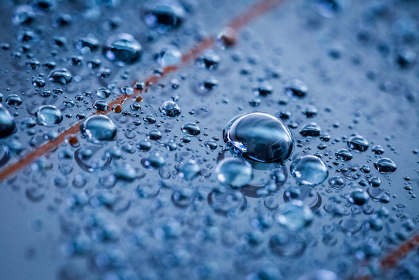 Water droplets on blue background - Foto, Imagen