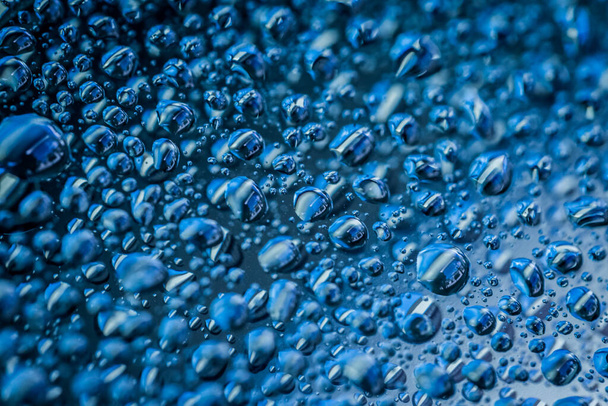 Water droplets on blue background - Фото, изображение