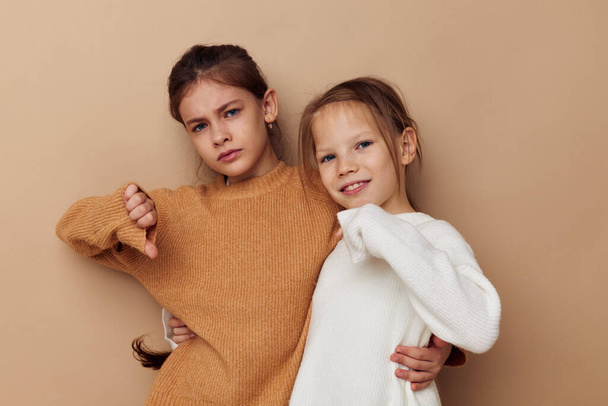 two cute little girls hug friendship childhood posing - Foto, imagen