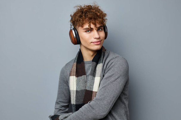 stylish guy plaid scarf wireless headphones technology Lifestyle unaltered - Φωτογραφία, εικόνα