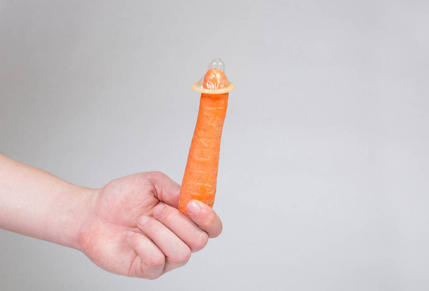 Condom in man's hand, contraception, health safety, safe love - Foto, imagen
