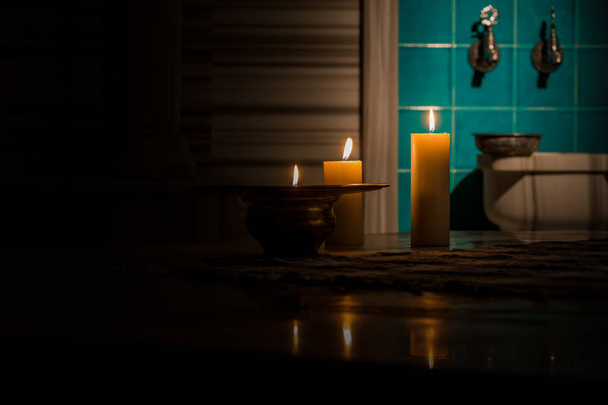 Traditional Turkish bath illuminated by candlelight - Foto, afbeelding