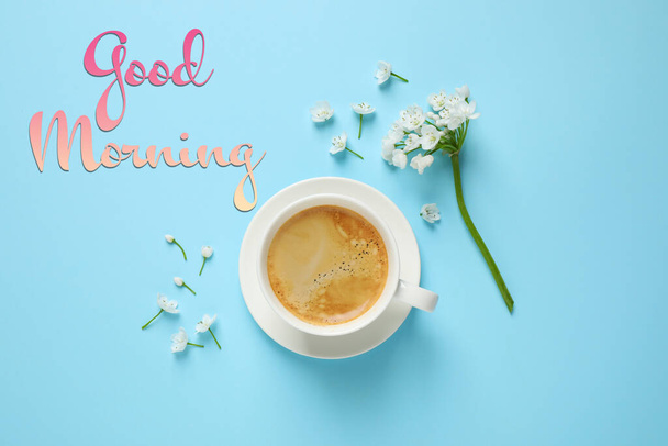 White flowers and coffee on light blue background, flat lay. Good morning - Foto, imagen