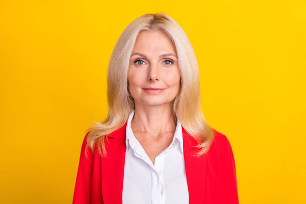 Photo of mature attractive woman intelligent employer executive investor isolated over yellow color background. - Foto, Imagem