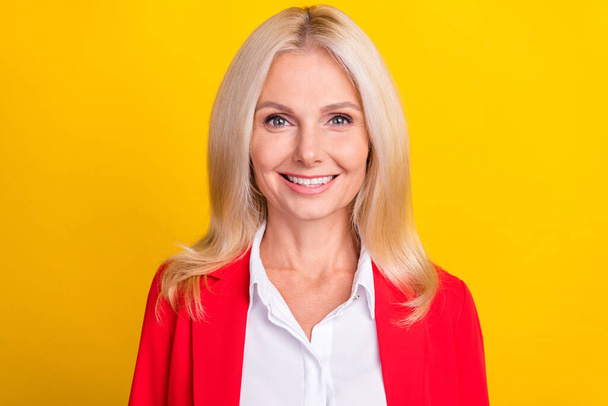 Photo of cheerful senior business woman woman toothy smile clever agent isolated over yellow color background. - Foto, Imagem