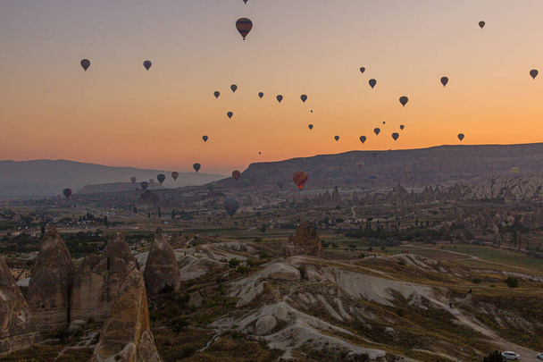 Hot air balloons above Cappadocia landscape, Turkey - Фото, изображение
