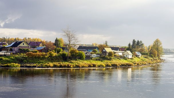 The village on the river side in autumn - Photo, Image