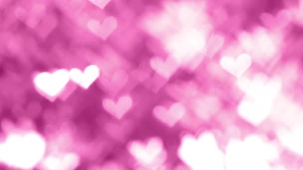 Αφηρημένη Valentine defocused φόντο, καρδιά σχήμα bokeh των φύλλων της φύσης ταλαντεύεται στον άνεμο σε ροζ φόντο - Πλάνα, βίντεο