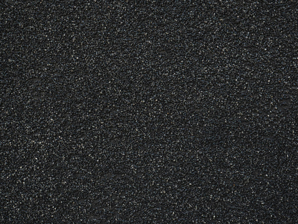 Μαύρο σκληρό φόντο. Ωραίος ασφαλτοστρωμένος δρόμος. Αδιάβροχη υφή. Στο πάνω μέρος. Επιφάνεια Stucco. Σκούρο αφηρημένο μοτίβο - Φωτογραφία, εικόνα
