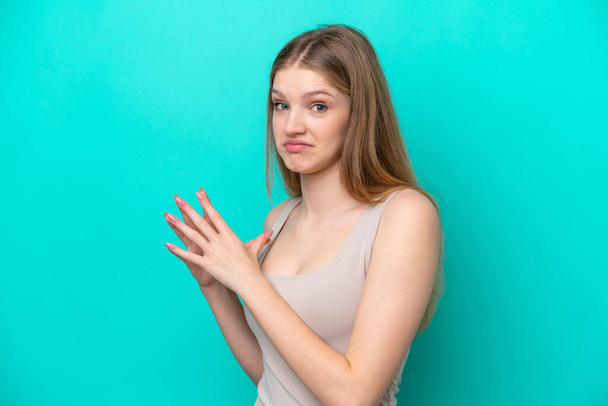 Teenager Russian girl isolated on blue background scheming something - Photo, Image