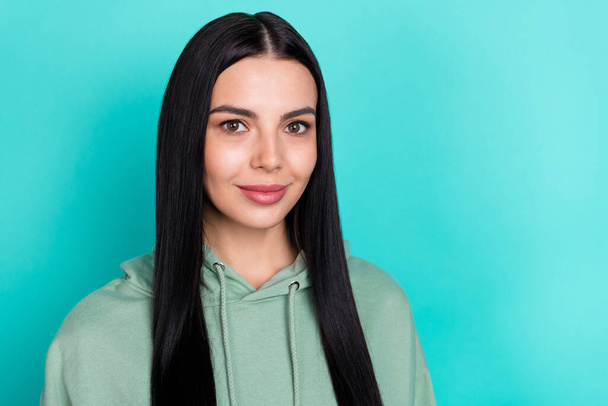 Photo of pretty young black hairstyle lady wear green hoodie isolated on teal color background - Φωτογραφία, εικόνα