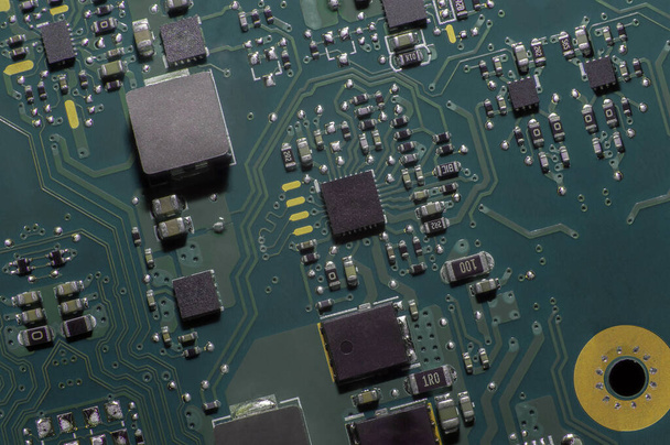 Electronic circuit. Electronic printed circuit board. Part of the motherboard of a desktop computer, laptop, radio elements. - Foto, Bild
