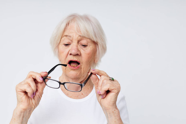 Photo of retired old lady vision problems with glasses close-up - Zdjęcie, obraz