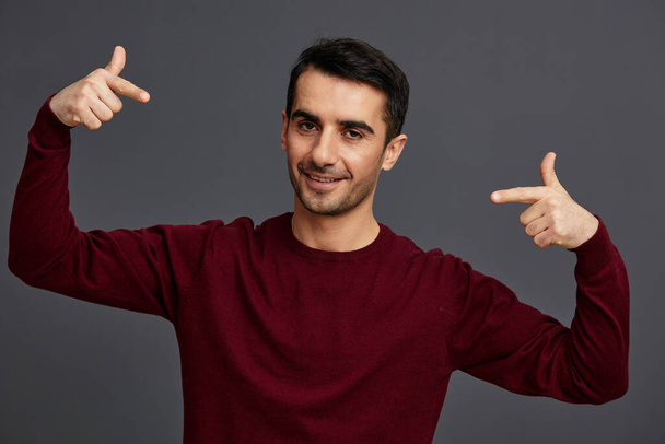 successful man posing smile gesture hands red sweater cropped view - Photo, Image