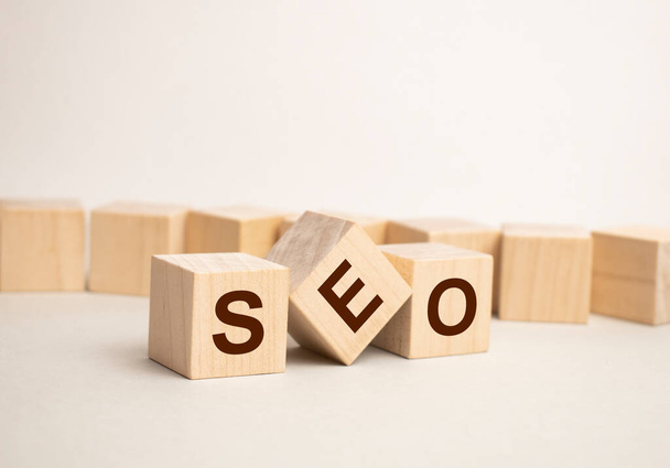 SEO Search Engine Optimization text wooden cube blocks on table background. Idea, Vision, Strategy, Analysis, Keyword and Content concept - Foto, afbeelding