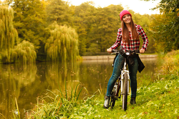 Girl in park with bicycle - Fotoğraf, Görsel