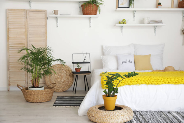 Stylish interior of modern bedroom with houseplants - Photo, Image